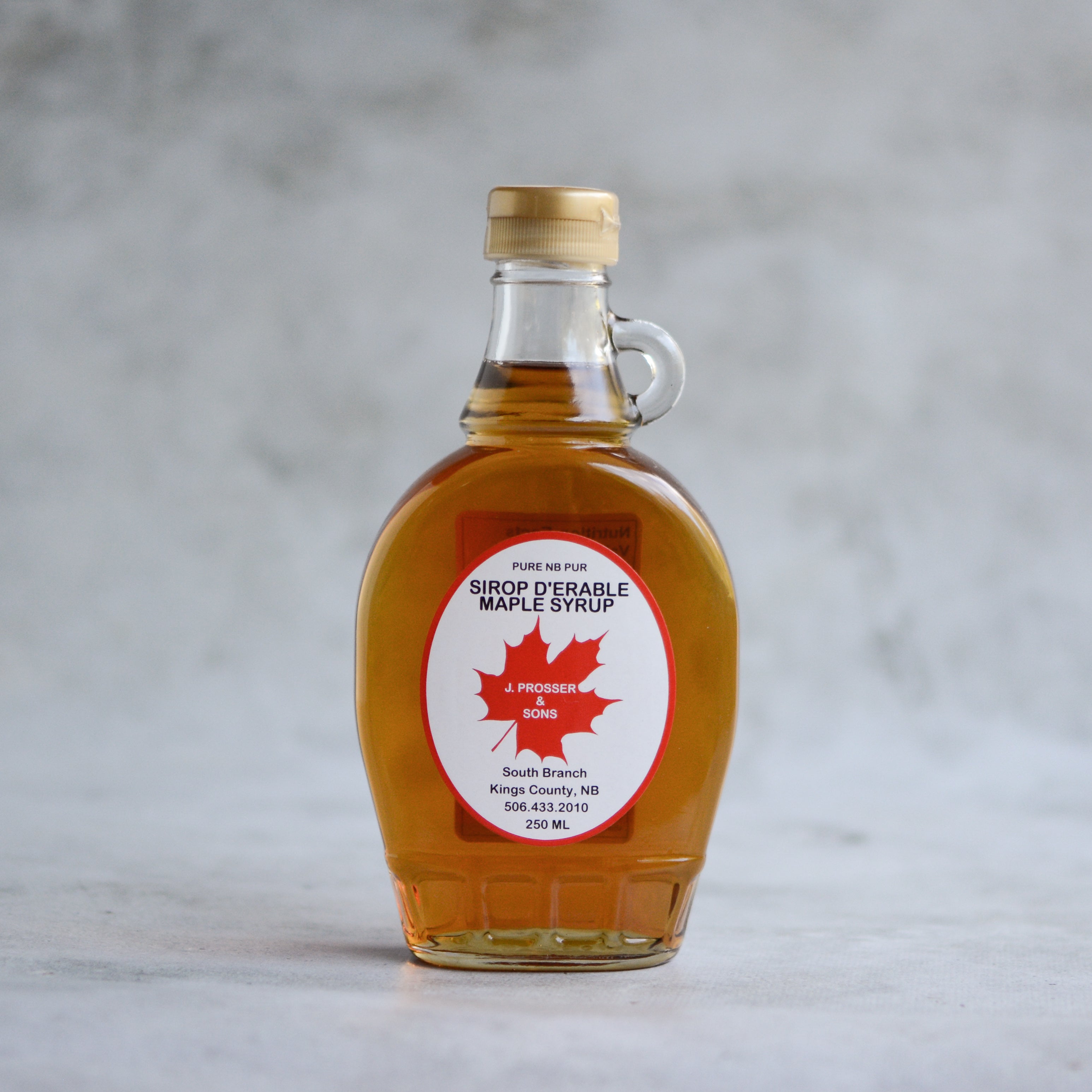 NMS 12 Ounce Glass Maple Syrup Bottles with Loop Handle & White Metal Lids  - Case of 12